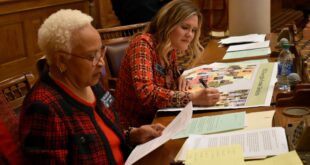 Sen. Elena Parent, right, takes on a map during the 2021 special redistricting session, while Senate Minority Leader Gloria Butler looks at notes.