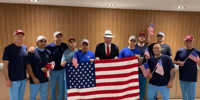 Freed Americans with U.S. diplomat John McNamara.
