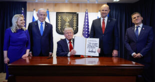 President Donald J. Trump signs the guest book at the Knesset
