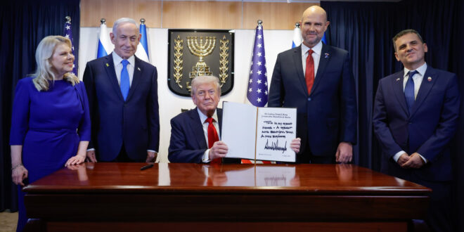 President Donald J. Trump signs the guest book at the Knesset