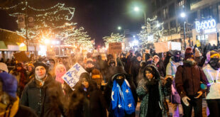 Hundreds gather around a growing memorial site at 26th Street and Nicollet Avenue, where federal agents shot and killed a 37-year-old Alex Pretti Saturday, Jan. 24, 2026 earlier in the day.