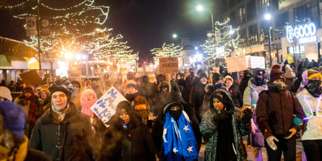 Hundreds gather around a growing memorial site at 26th Street and Nicollet Avenue, where federal agents shot and killed a 37-year-old Alex Pretti Saturday, Jan. 24, 2026 earlier in the day.