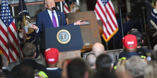 President Donald Trump touts his economic record in a speech in Rome, Georgia.