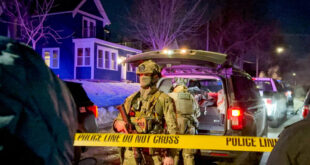 Federal immigration officers on the scene where an officer shot a man Wednesday, Jan. 14, 2026, in north Minneapolis.