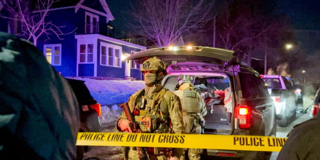 Federal immigration officers on the scene where an officer shot a man Wednesday, Jan. 14, 2026, in north Minneapolis.