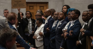 Tennessee Democrats lock arms on the Tennessee House floor in protest of a Republican redistricting vote that split up a majority-Black, majority-Democratic congressional district