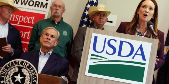 Gov. Greg Abbott listens as U.S. Secretary of Agriculture Brooke Rollins speaks at a presser detailing federal action on containing the spread of the screwworm in Texas